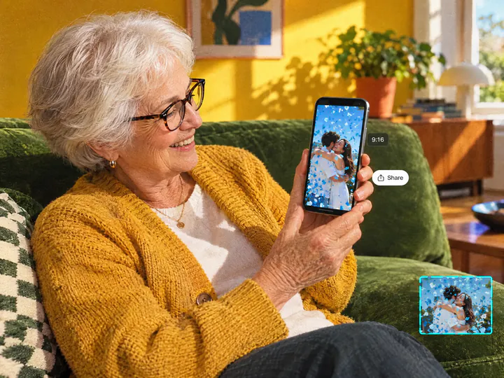 Grandmother on a sofa watching a vertical gender reveal video on her phone