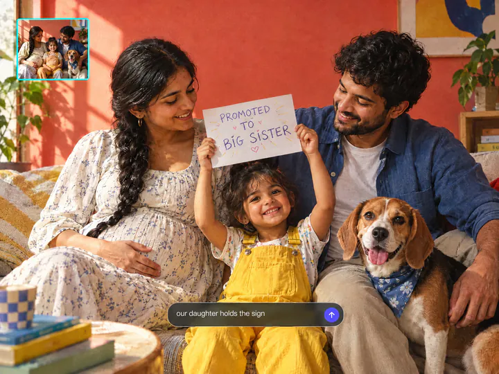 Family on a sofa, the little girl holds a sign that reads Promoted to big sister, a beagle in a bandana beside them