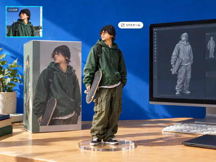 机の上に立つスケートボードを持った男性の1/7スケールフィギュアと箱とモニター。左上に元の写真
