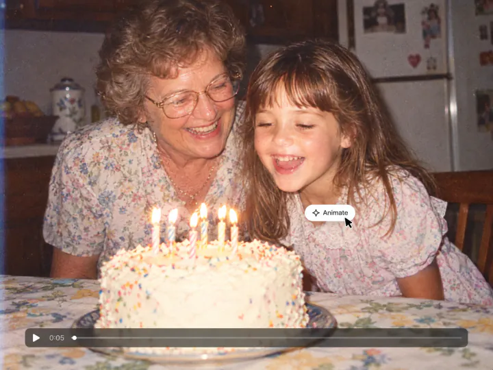 Grandmother and granddaughter blowing out birthday candles in an early 90s photo with a video timeline and an Animate button